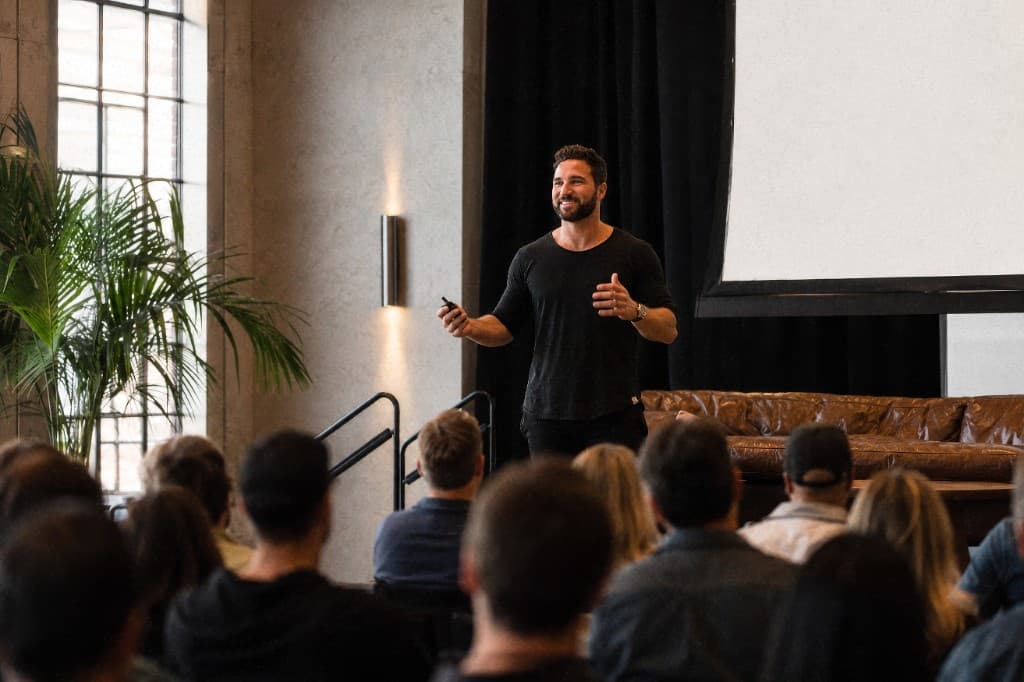 Luke Kish speaking on stage